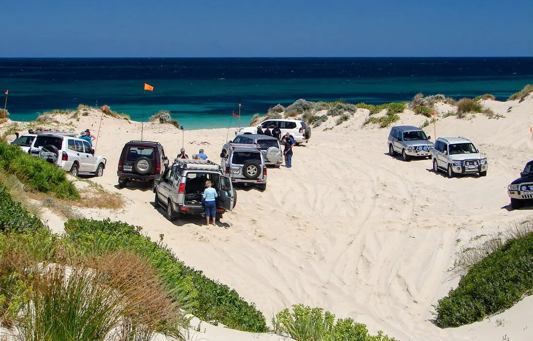 Four-wheel drives on beach sand dunes at Perth's northern beaches